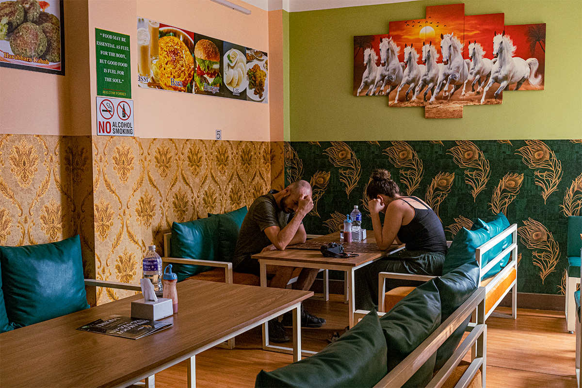 Foreigners enjoying meal at Annakot Veg Cuisine